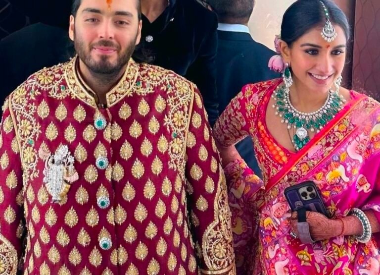 Anant Ambani wore a striking red Bundi jacket, custom-designed by Manish Malhotra.
